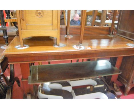 An early Victorian mahogany ledgeback buffet side table, raised on stepped block end supports united by platform undertier, w