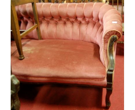 A late Victorian mahogany framed and pink button back upholstered two seater salon sofa