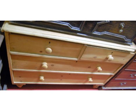 A Victorian pine ledgeback chest of two short over two long drawers on turned supports, width 121cm