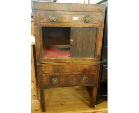 An early 19th century mahogany bedside commode having twin hinged top over tambour front door to further pull-out lower compa