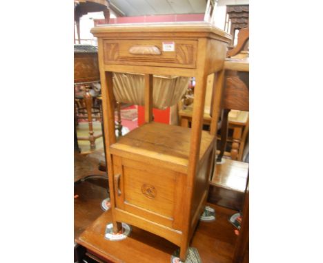 An early 20th century light oak and marble topped two-tier bedside table, having drawer over single cupboard door, w.36.5cm