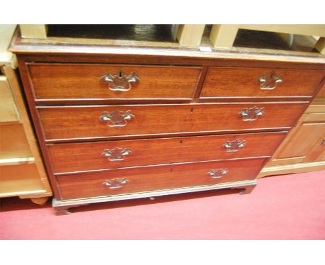 An early 19th century oak and crossbanded squarefront chest of two short over three long graduated drawers, on bracket suppor