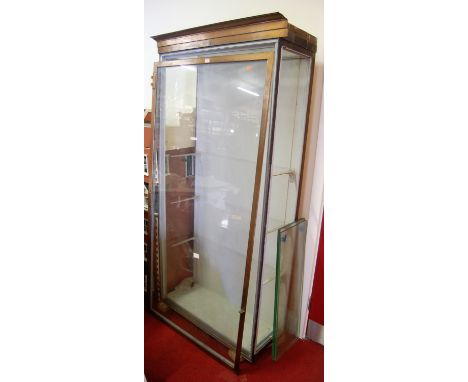 A reputedly ex-Victoria & Albert Museum single door brass display cabinet, early 20th century, with bronzed finish, the grey 