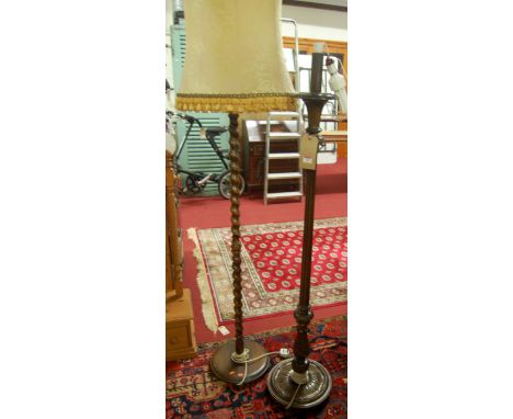 An early 20th century barleytwist turned standard lamp; together with a fluted standard lamp (2) 