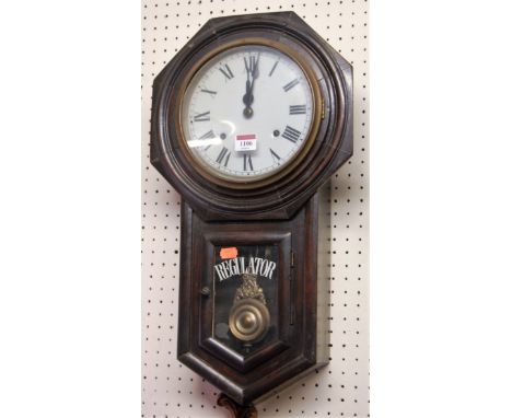 A late 19th century stained mahogany octagonal cased drop trunk wall clock having a white enamelled circular dial 
