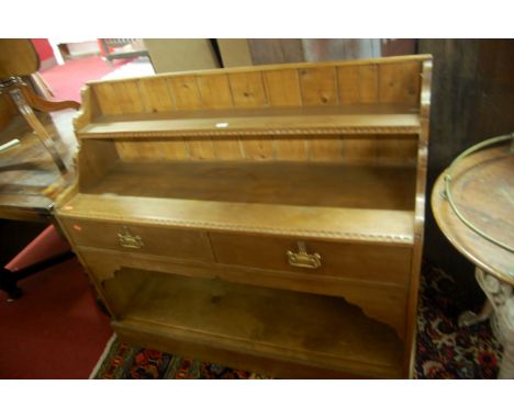 A small beech and pine dresser base, having integral raised shelf over tiwn frieze drawers, to lower plinth, w.118cm