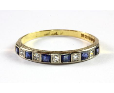An Art Deco 18ct yellow gold and platinum sapphire and diamond set half eternity ring, (U).