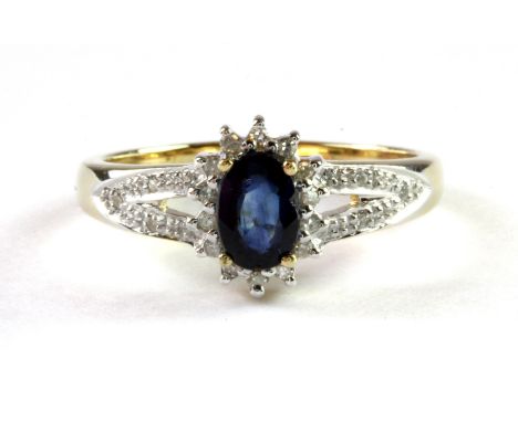 A 9ct yellow gold sapphire and diamond set cluster ring, (L.5).