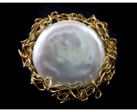 A unique Leo designer yellow metal (tested 9ct gold) ring set with a large baroque pearl, (O).