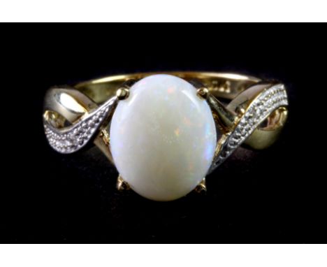 A 9ct yellow gold opal and diamond set ring, (L.5).