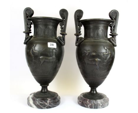 A pair of heavy bronze classical urns on red and grey granite bases, H. 43cm.