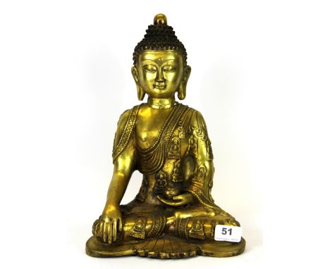 A Tibetan gilt bronze figure of the seated Buddha, H. 32cm.