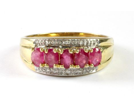 A 9ct yellow gold ruby and diamond set ring, (O.5).