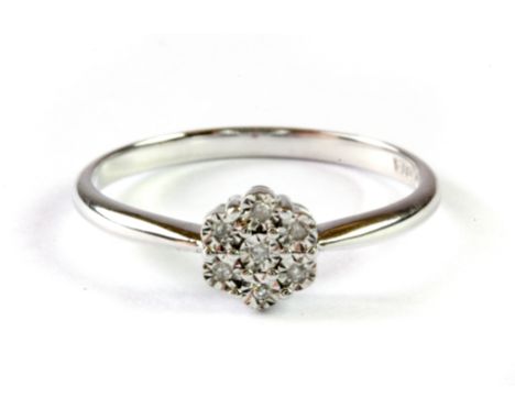 A 9ct white gold diamond set cluster ring, (L.5).