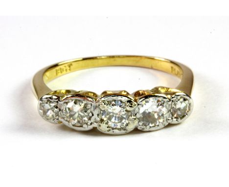An 18ct yellow gold and platinum five stone diamond set ring, (M.5).