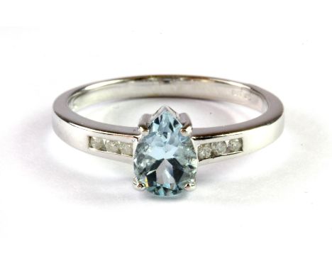 A 9ct white gold ring set with a pear cut aquamarine and diamond set shoulders, (L.5).