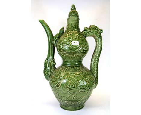 A very large Chinese crackled celadon glazed wine jug and lid, with a dragon handle and elephant trunk spout, H. 61cm.