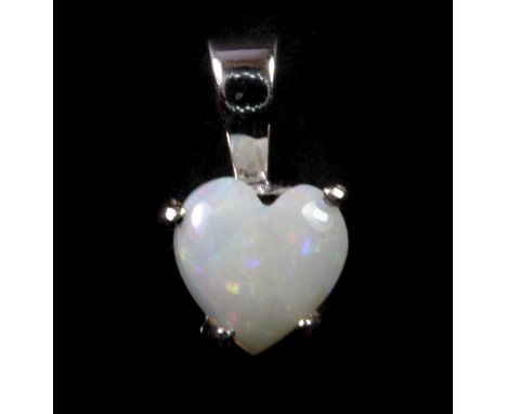 A 9ct white gold opal set heart shaped pendant, L. 1cm.