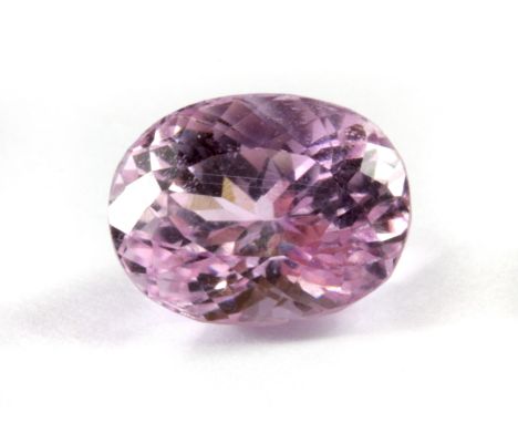 An unmounted 4.81ct oval cut light pink kunzite, 11 x 8.6 x 7.9cm.