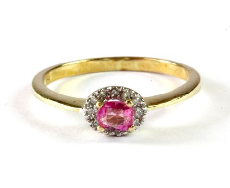 A 9ct yellow gold natural untreated Burmese pink sapphire and diamond set halo ring, (M.5).