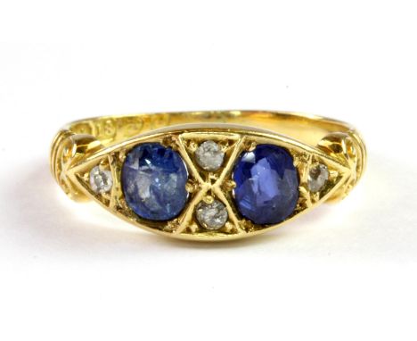 An antique 18ct yellow gold ring set with Ceylon sapphires and diamonds, (K).