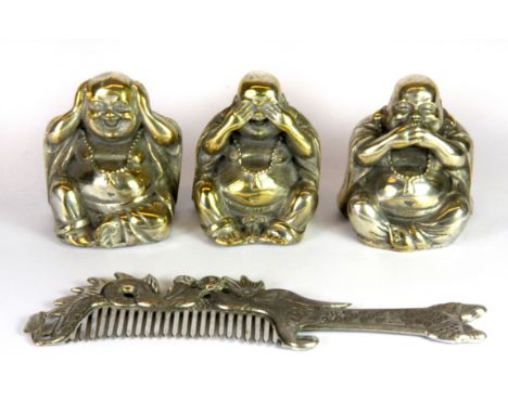 Three silvered brass figures of the Happy Buddha with a white metal dragon comb.