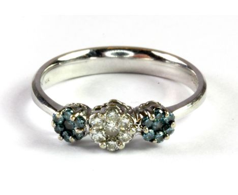 A 14ct white gold (stamped 14k) triple cluster ring set with fancy blue and white diamonds, (O.5).