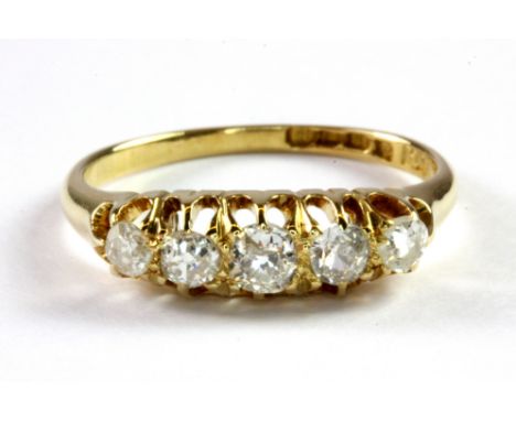 An antique 18ct yellow gold five stone ring set with old cut diamonds, (O.5).