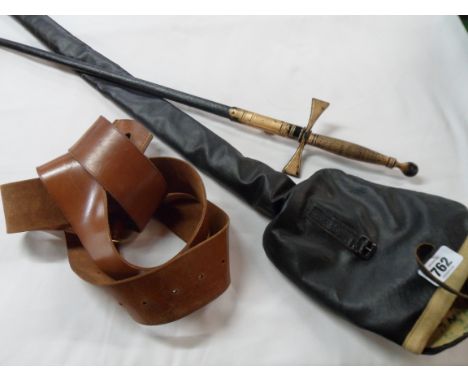 A vintage Toledo (Spain) dress sword with decorative chased blade with scabbard and outer canvas cover and a leather dress be