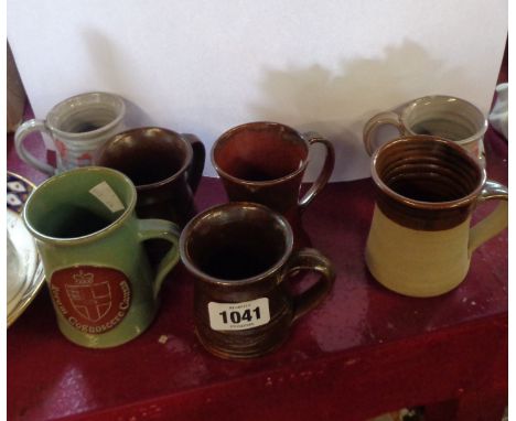 A quantity of studio pottery mugs including Jeremy Leach, etc.