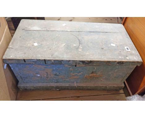 An old wooden lift-top tool chest with green painted finish