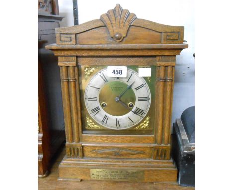 An early 20th Century oak cased mantel clock with decorative dial and HAC eight day striking movement