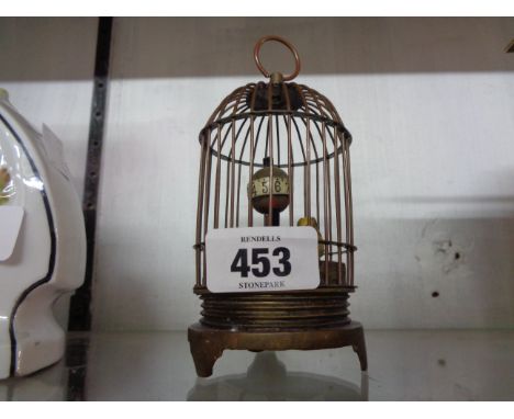 A small reproduction birdcage automaton style timepiece with mechanical movement