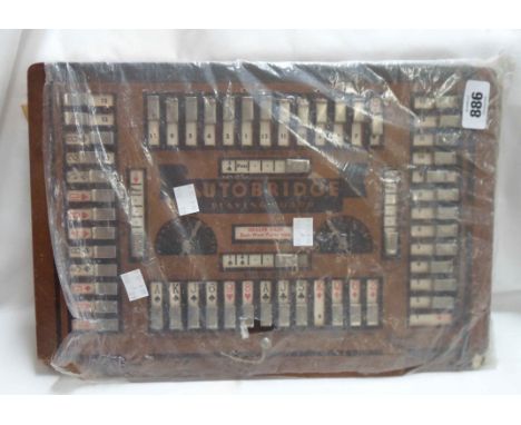 A vintage Autobridge playing board card game with quantity of instructions and playing sheets