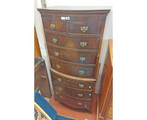 A 70cm antique mahogany bow front chest on chest with dentil cornice, two short and three long graduated drawer, over three f