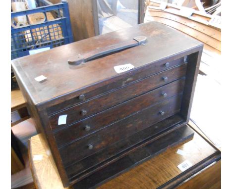 A 41cm vintage stained oak engineer's tool chest with pull-out front enclosing four long graduated drawers