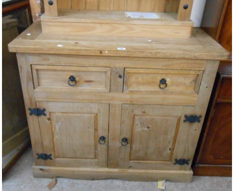 A 1.07m modern pine dresser base with two short drawers over a pair of panelled cupboard doors with iron strap hinges, set on