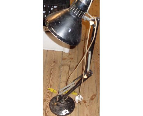 A vintage anglepoise lamp with black painted finish
