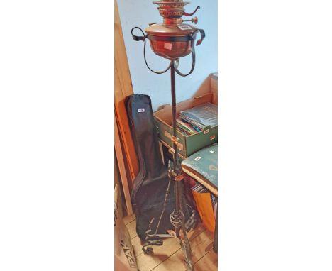 A Victorian painted wrought iron telescopic oil lamp standard with applied detailing, copper reservoir and Veritas burner