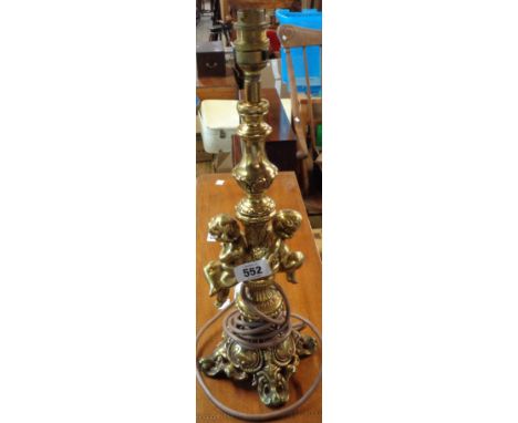 A mid 20th Century cast brass table lamp of classical stick form with cherub decoration