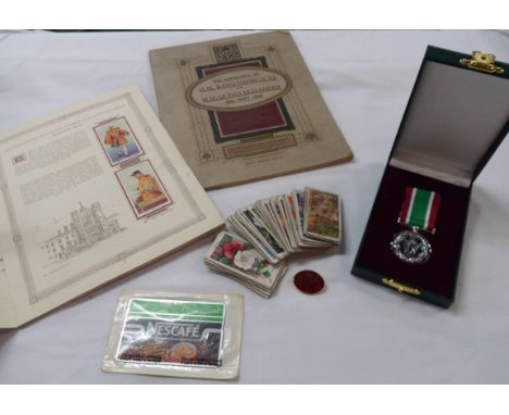 A box containing two Player's Cigarette card albums comprising The Coronation of H.M. King George VI and Queen Elizabeth 1937