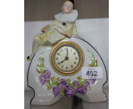 A small vintage decorative ceramic cased timepiece with pierrot and grapevine decoration - simple thirty hour movement