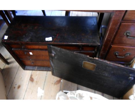 A 61cm vintage stained oak engineer's tool chest with pull-out front enclosing a flight of five long graduated drawers