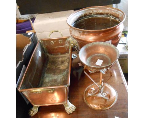 An old copper trough form planter with cast brass paw feet and handles - sold with a copper jardiniere with lion mask handles