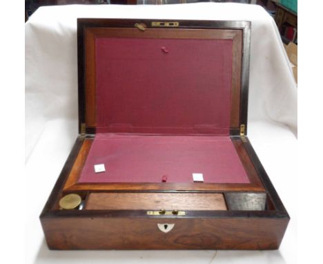 A Victorian rosewood veneered writing slope with fitted interior, inkwell and stamp holder