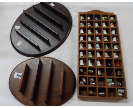 A thimble stand containing a quantity of ceramic and other thimbles including Spode, Wedgwood, Limoges, etc. - sold with two 