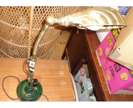 A 1920's desk lamp with green painted cast iron base and column with brass adjustable hinges and fittings, swan neck stem and