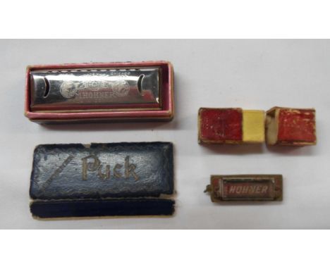 A Hohner miniature harmonica in original box - sold with a slightly larger similar - both boxes a/f