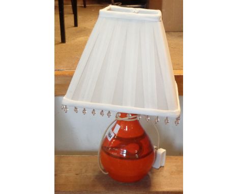 A vintage Fosters Cornish Art Pottery table lamp with hand painted decoration and an orange glaze finish