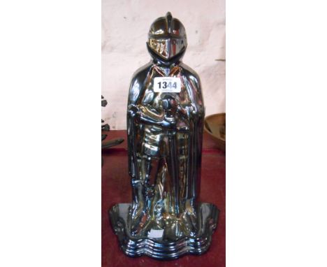 A cast iron and enamel knight pattern companion set